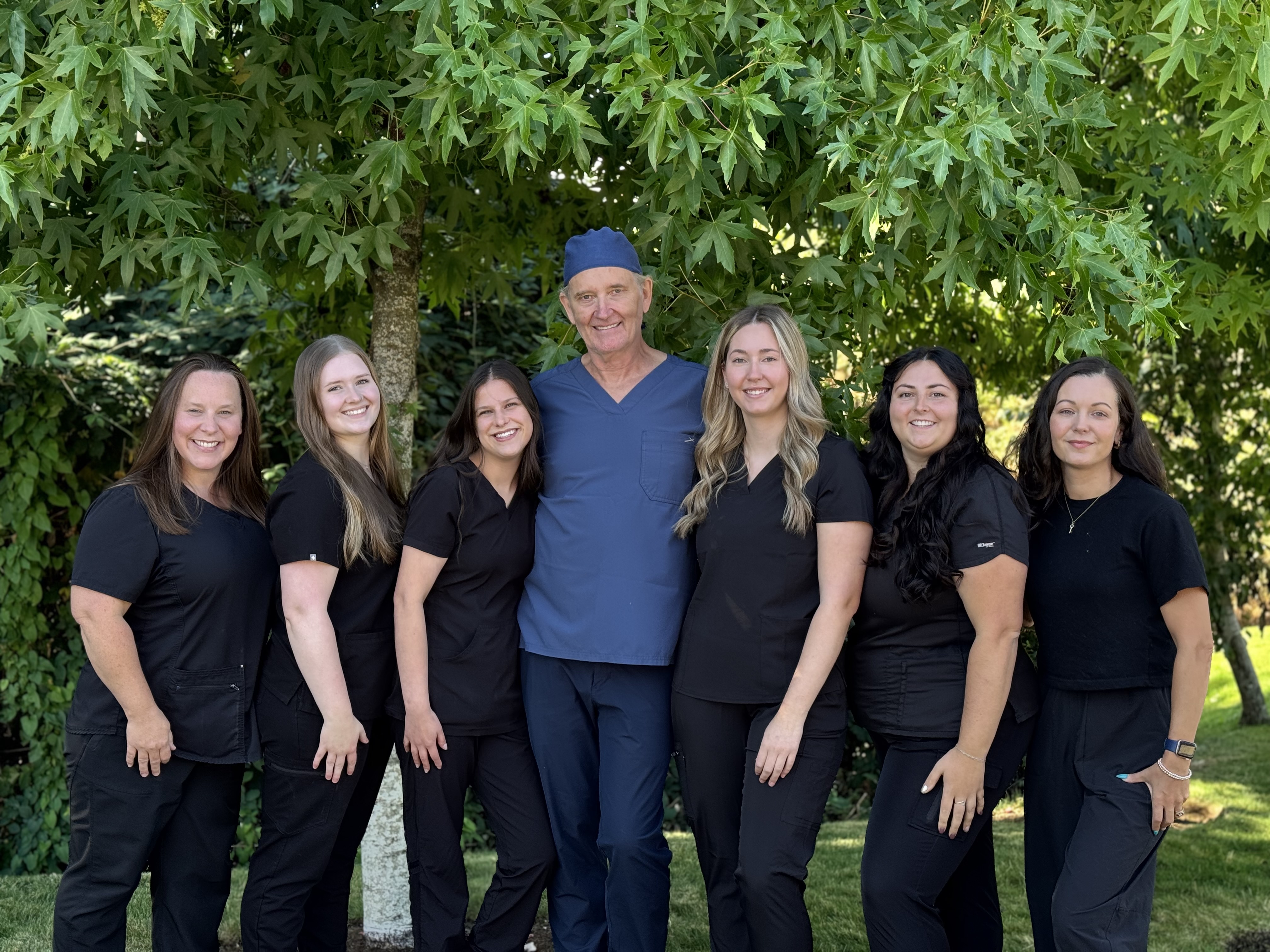 Dr. John Christensen with the Metral Dental care team